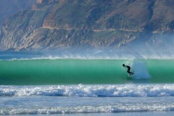 A surfer on a perfect wave, Noordhoek beach, Cape Town, Western Cape
